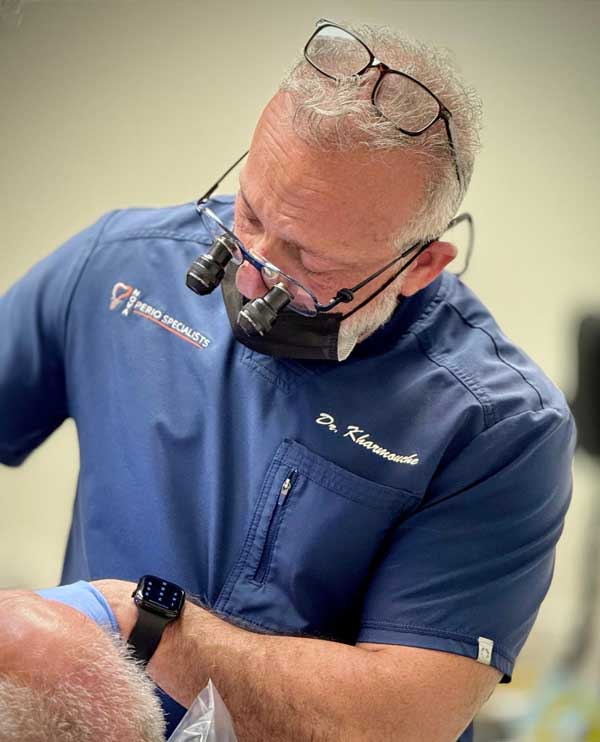 Dr. Jean-Claude Kharmouche performing specialty periodontal care