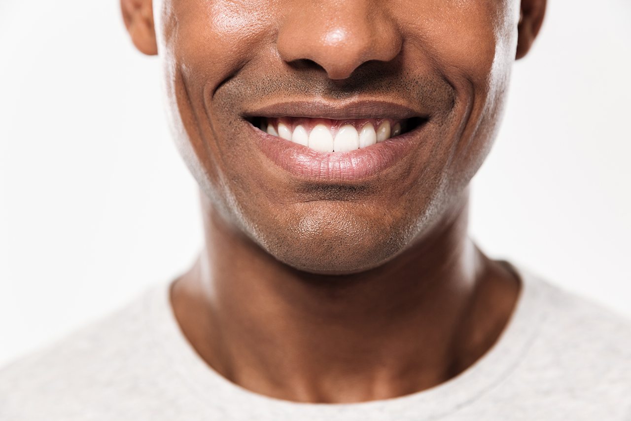 Smiling patient contacting Nova Implant & Perio Specialists in Northern Virginia